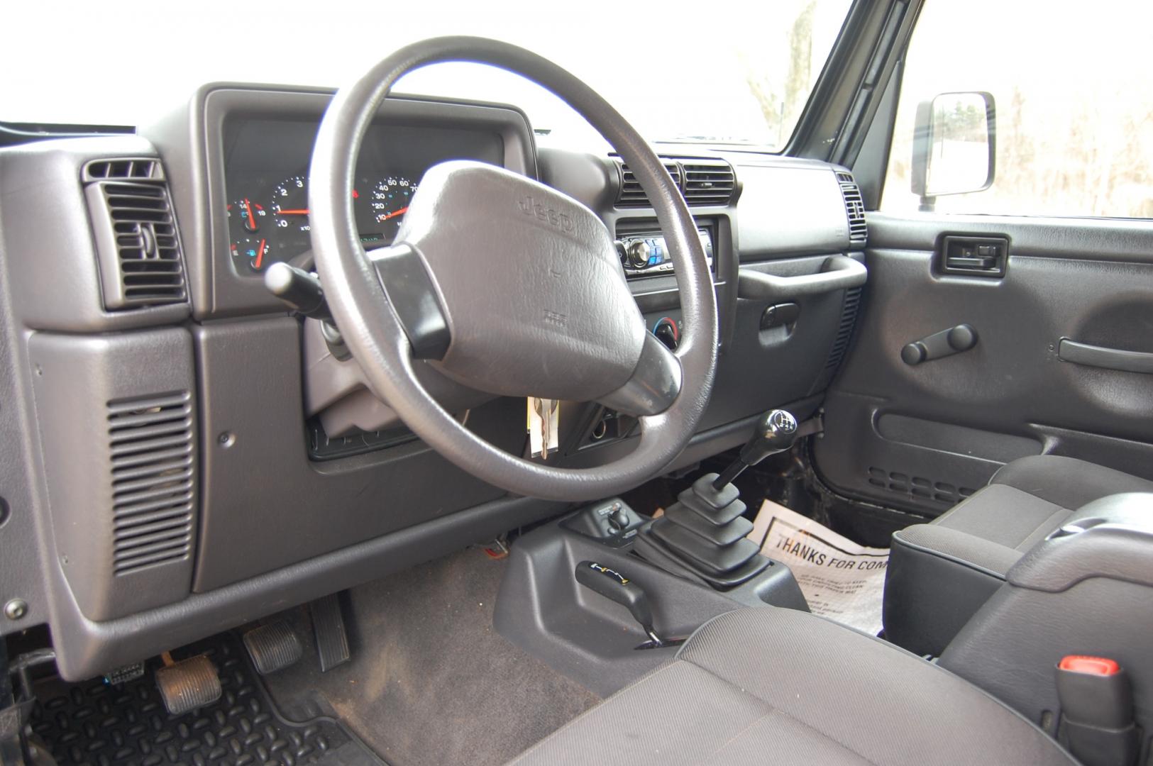 2002 Black /Black cloth Jeep Wrangler SE (1J4FA29P62P) with an 2.5 liter 4 cylinder engine, 5 speed manual transmission, located at 6528 Lower York Road, New Hope, PA, 18938, (215) 862-9555, 40.358707, -74.977882 - Here for sale is a 2002 Jeep Wrangler SE. Under the hood is a good running 2.5 liter 4 cylinder which puts power to 2 or 4 wheels via a nice shifting 5 speed manual transmission with a solid clutch. Features include; Black cloth interior, 3 keys, Air conditioning, AM/FM stereo, Alpine head unit, D - Photo#6